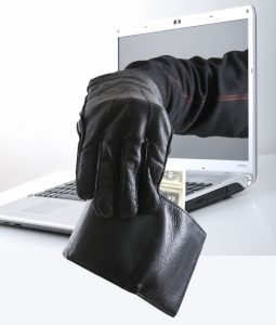 Hacker taking money out of pocket concet